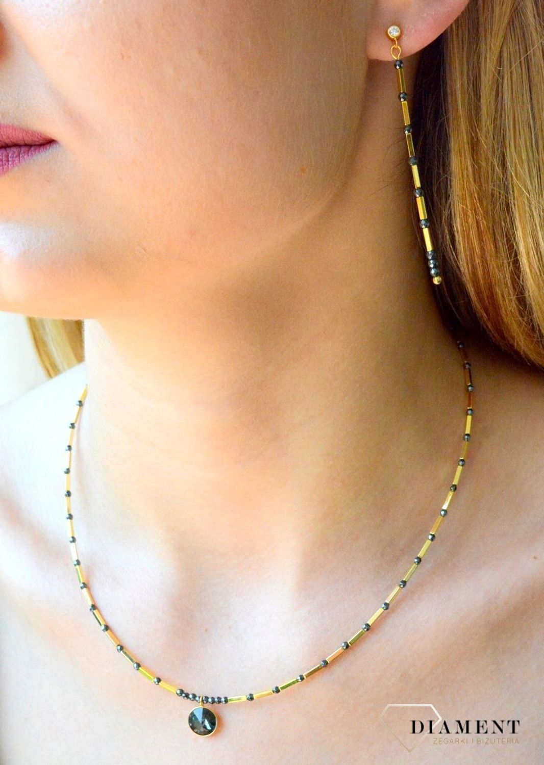 Kolczyki srebrne Spark pokryte złotem Marigold Long w kolorze Silver KHEG1B. Kolczyki wiszące Spark z kamieniami naturalnymi. Kolczyki w złoto-czarnym kolorze. Koczyki pozłacane Spark. Idealne kolczyki na prezent..jpg