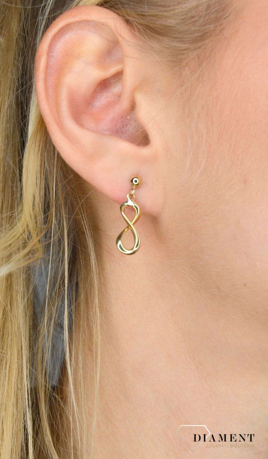 Złote kolczyki wiszący znak nieskończoności.jpg