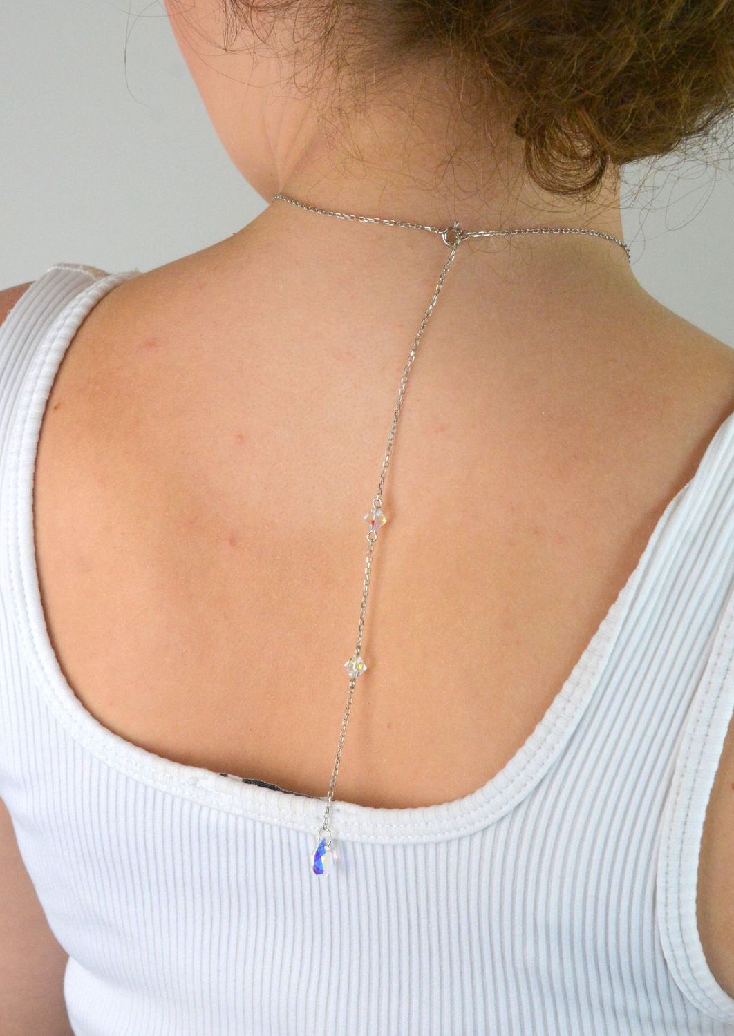 Elegancki naszyjnik Spark Two Faces NBACK6433CSH wykonany z srebra próby 925 pokrytego platyną, ozdobiony kryształami Crystal Shimmer i Aurora Borealis. Długość łańcuszka 59 cm (42 cm + 17 cm pr.jpg