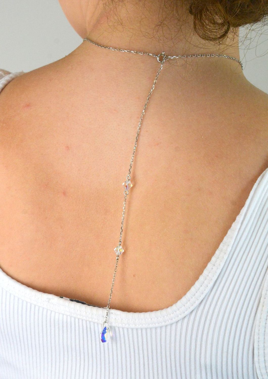 Elegancki naszyjnik Spark Two Faces NBACK6433CSH wykonany z srebra próby 925 pokrytego platyną, ozdobiony kryształami Crystal Shimmer i Aurora Borealis. Długość łańcuszka 59 cm (42 cm + 17 cm pr.jpg