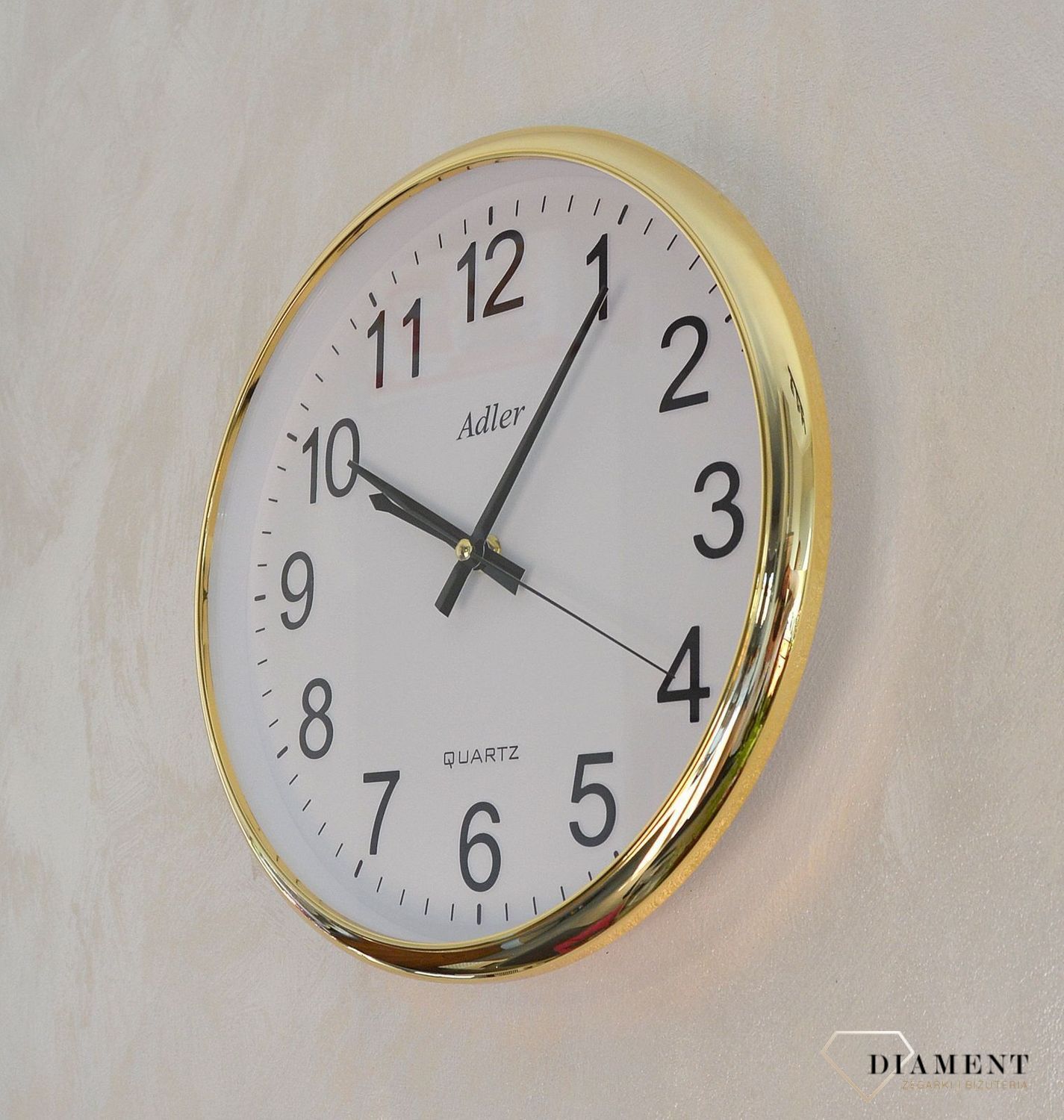 Zegar ścienny okrągły Adler złoty PW110-1700-G. Zegar ścienny okrągły zasilany za pomocą baterii. Zegar ścienny okrągły z tworzywa sztucznego w kolorze złotym z czarnymi dodatkami. Zegar ścienny (2).JPG