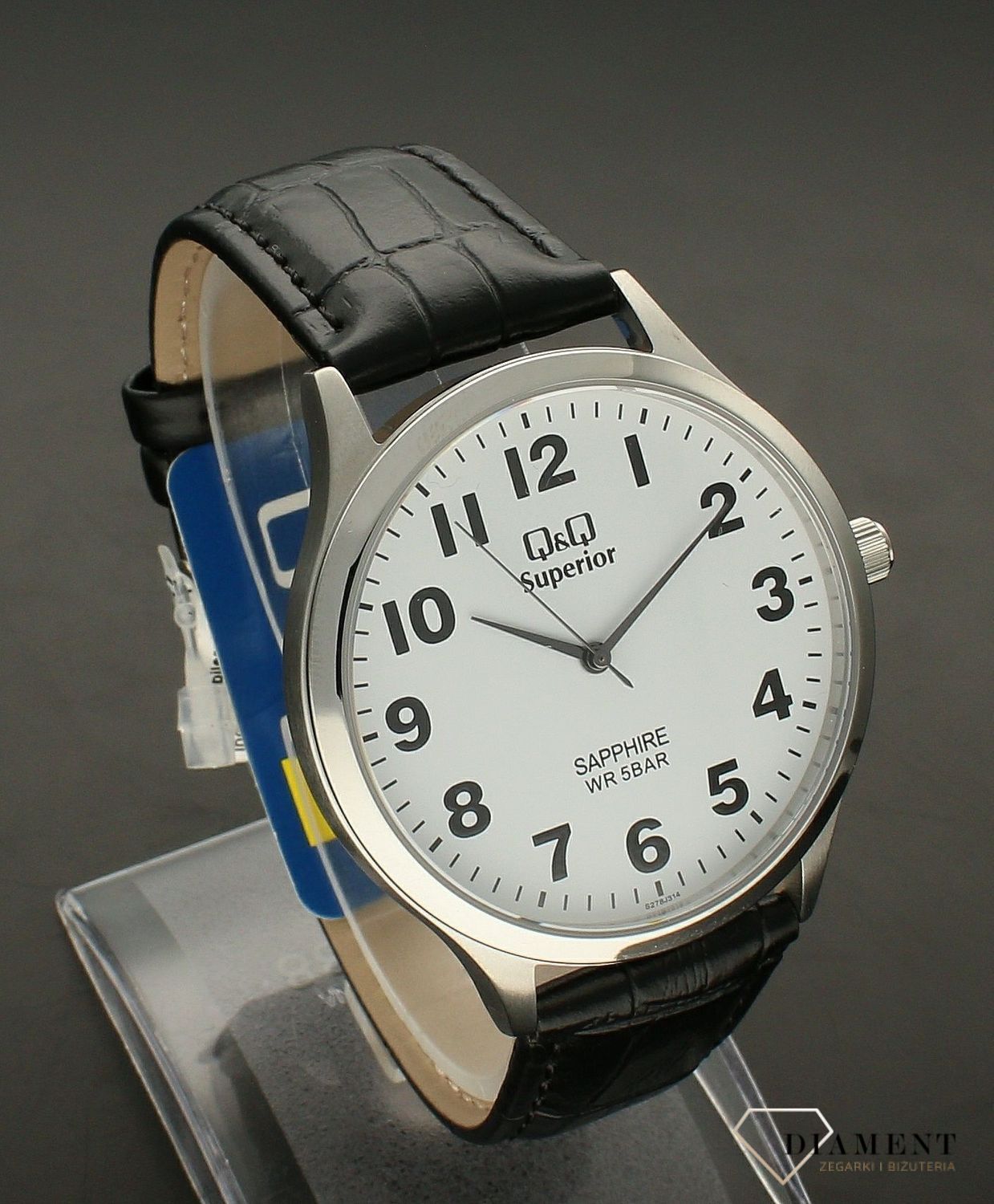 Zegarek męski na czarnym pasku QQ S278-314. Zegarek wyposażony w szkło szafirowe, które oprócz niezwykłej twardości (stopień 9 w skali Mohsa) charakteryzuje się także odpornością na skrajne różnice temperaturowe.jpg
