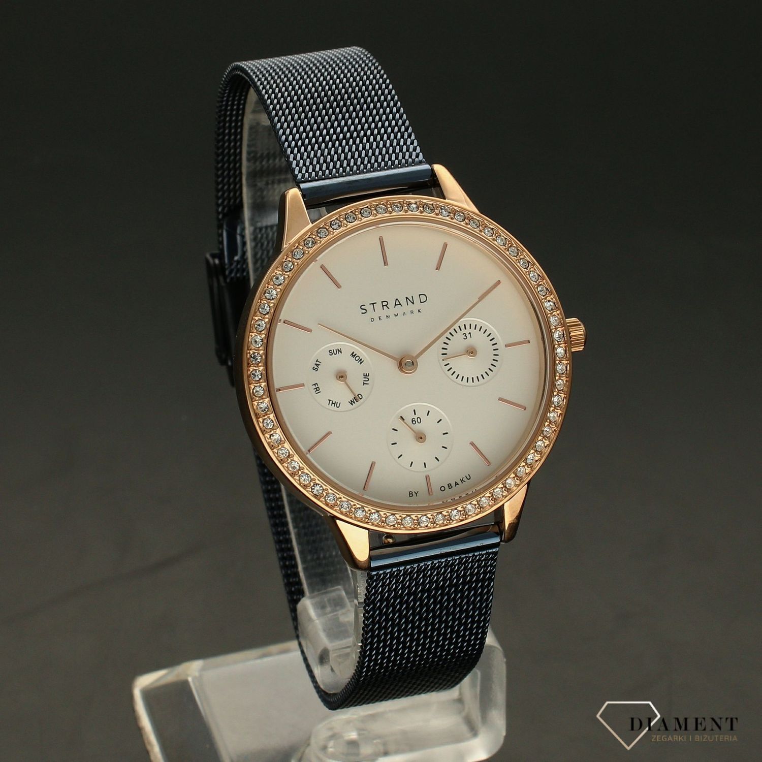 Zegarek damski STRAND Denmark S704LMVIML.. Strand Denmark to elegancki zegarek damski z oryginalną, białą tarczą oraz kopertą ozdobioną błyszczącymi kryształami Swarovskiego. Zegarek damski posiada indeksy w kolorze7.jpg