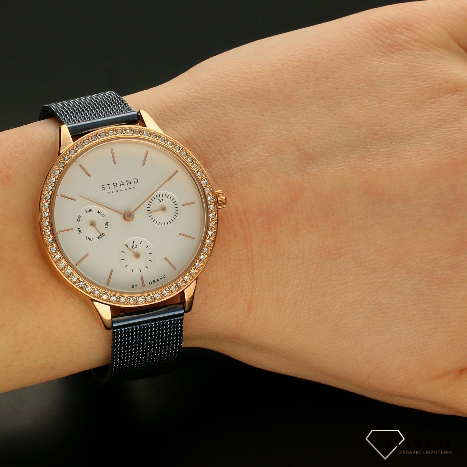 Zegarek damski STRAND Denmark S704LMVIML.. Strand Denmark to elegancki zegarek damski z oryginalną, białą tarczą oraz kopertą ozdobioną błyszczącymi kryształami Swarovskiego. Zegarek damski posiada indeksy w kolorze7.jpg