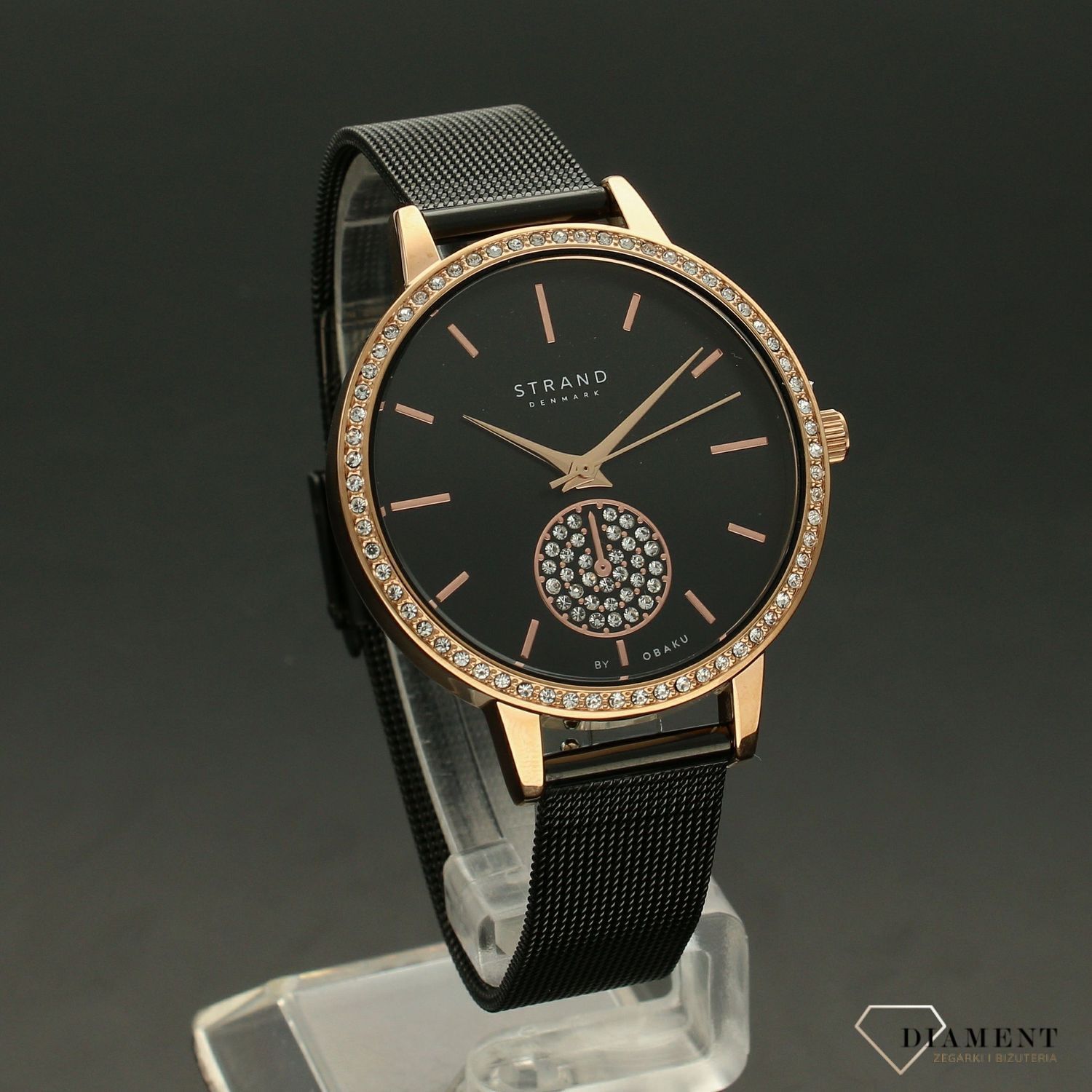 Zegarek damski STRAND Denmark S705LXVBMB. Strand Denmark to elegancki zegarek damski z oryginalną, czarną tarczą, ozdobioną błyszczącymi kryształami Swarovskiego. Zegarek damski posiada indeksy w kolorze różowego zł8.jpg