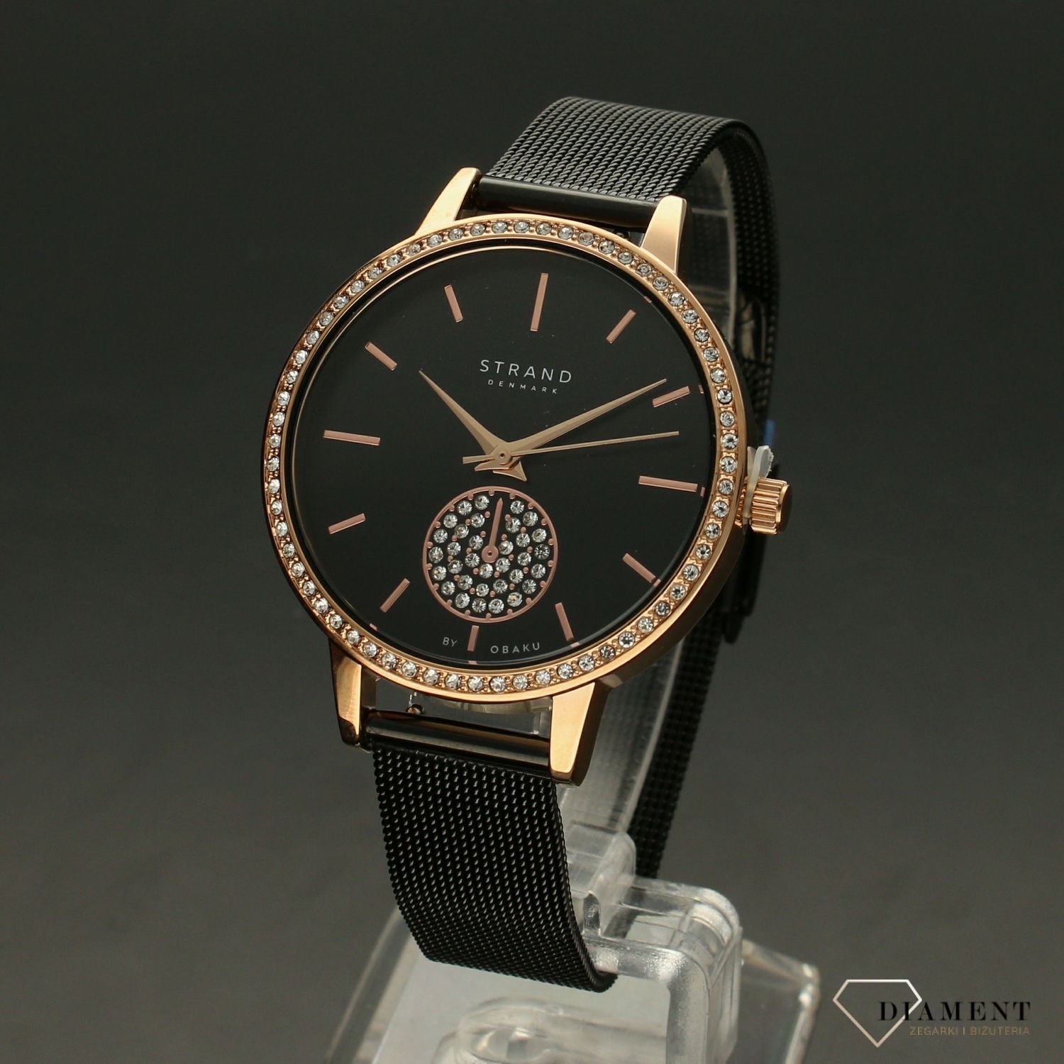 Zegarek damski STRAND Denmark S705LXVBMB. Strand Denmark to elegancki zegarek damski z oryginalną, czarną tarczą, ozdobioną błyszczącymi kryształami Swarovskiego. Zegarek damski posiada indeksy w kolorze różowego zł8.jpg