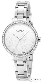 Zegarek damski STRAND Pacifica S712LXCISC. Strand Pacifica to elegancki zegarek damski z oryginalną, białą tarczą ozdobioną kwiatowym motywem. Zegarek damski posiada indeksy ze srebra. Tarcza ozdobiona jest błyszczą8.jpg