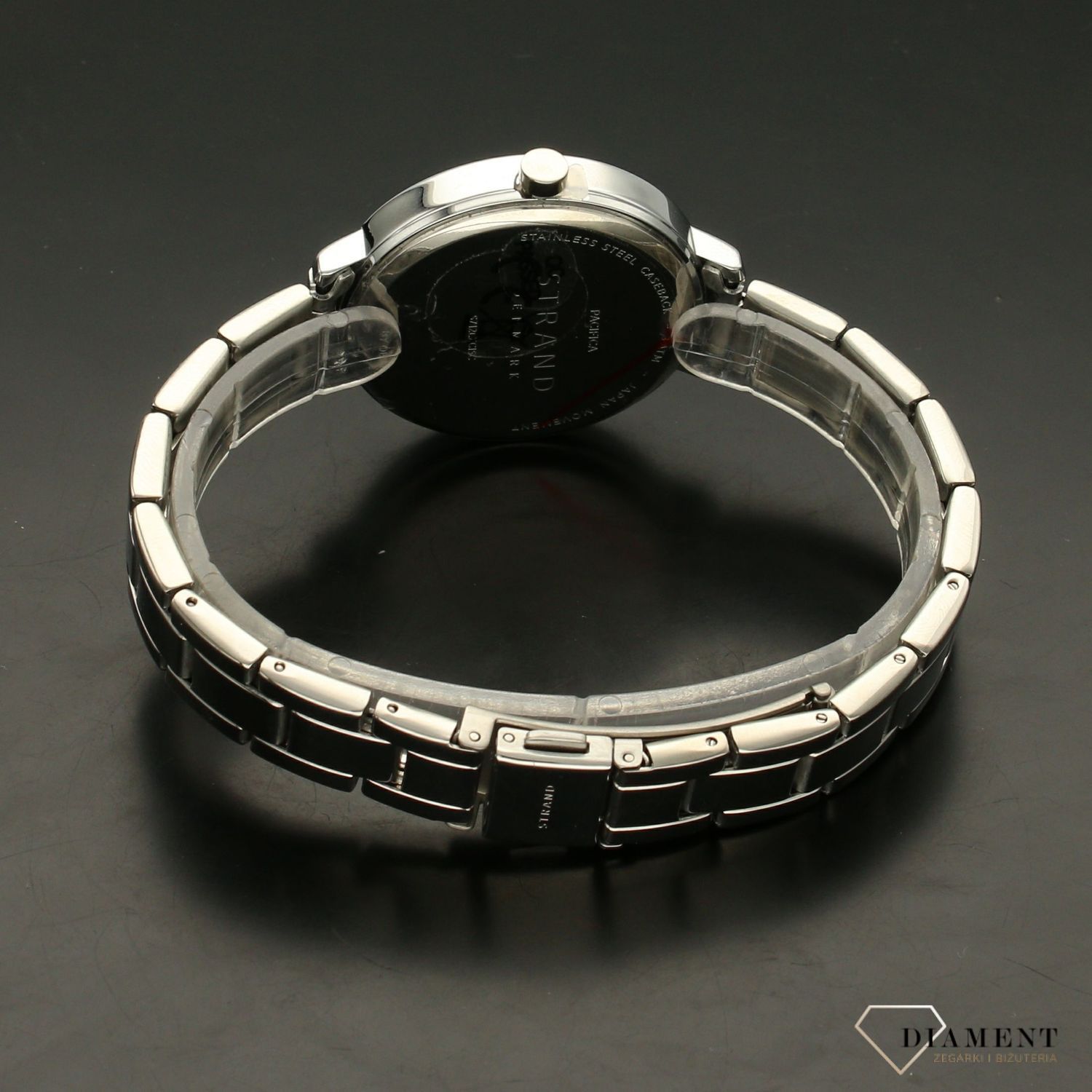 Zegarek damski STRAND Pacifica S712LXCISC. Strand Pacifica to elegancki zegarek damski z oryginalną, białą tarczą ozdobioną kwiatowym motywem. Zegarek damski posiada indeksy ze srebra. Tarcza ozdobiona jest błyszczą8.jpg