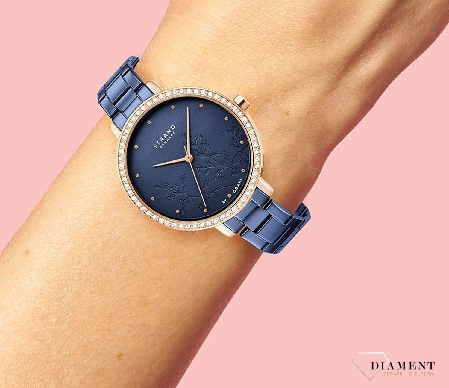 Zegarek damski STRAND Pacifica S712LXVLSL. Strand Pacifica to elegancki zegarek damski z oryginalną, granatową tarczą, ozdobioną motywem kwiatowym. Zegarek damski posiada indeksy z różowego złota. Tarcza ozdobiona j8.jpg