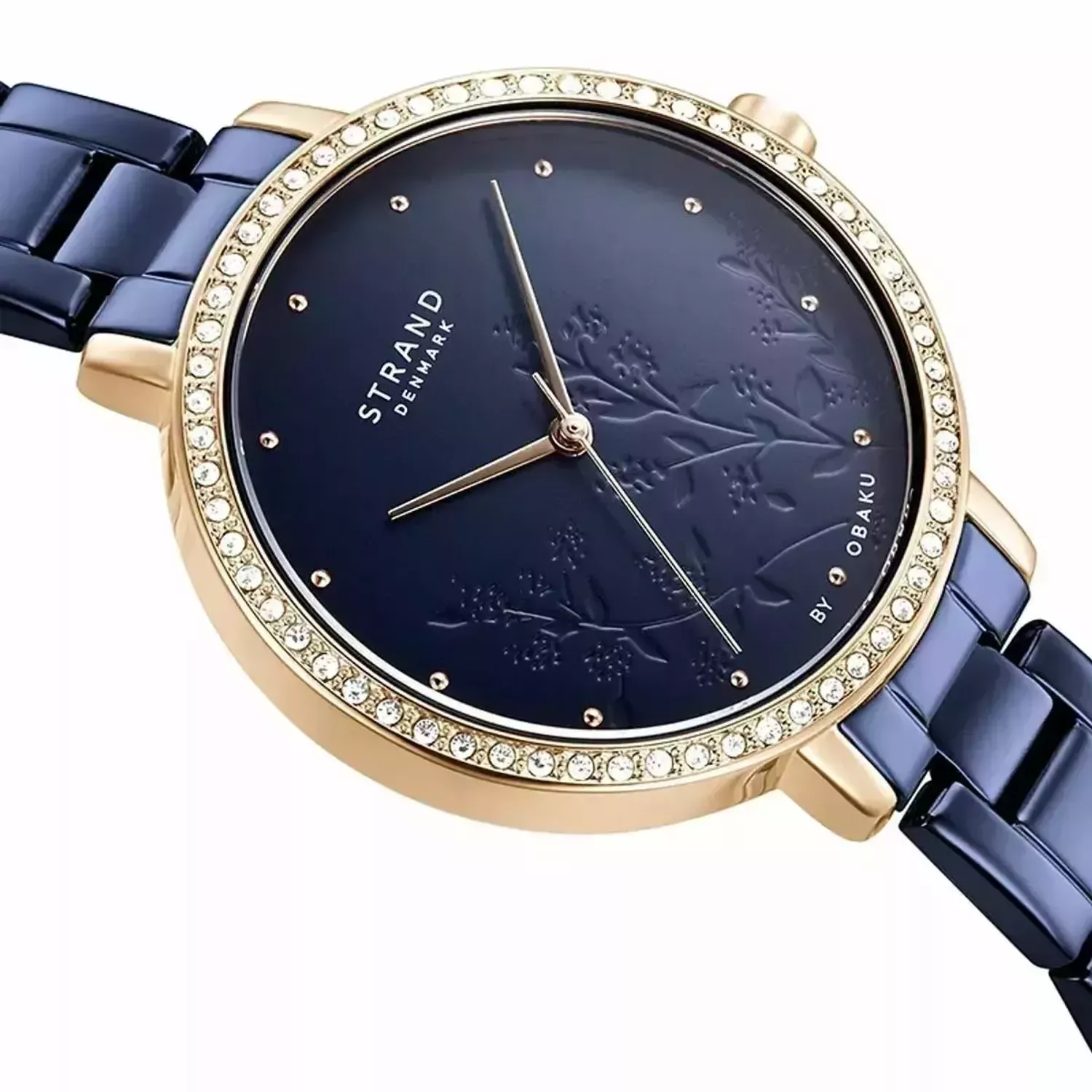 Zegarek damski STRAND Pacifica S712LXVLSL. Strand Pacifica to elegancki zegarek damski z oryginalną, granatową tarczą, ozdobioną motywem kwiatowym. Zegarek damski posiada indeksy z różowego złota. Tarcza ozdobiona j8.jpg