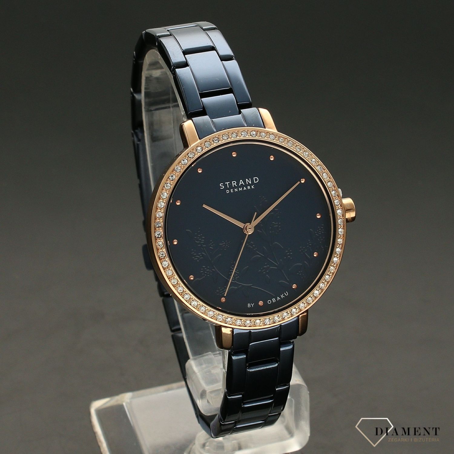 Zegarek damski STRAND Pacifica S712LXVLSL. Strand Pacifica to elegancki zegarek damski z oryginalną, granatową tarczą, ozdobioną motywem kwiatowym. Zegarek damski posiada indeksy z różowego złota. Tarcza ozdobiona j8.jpg