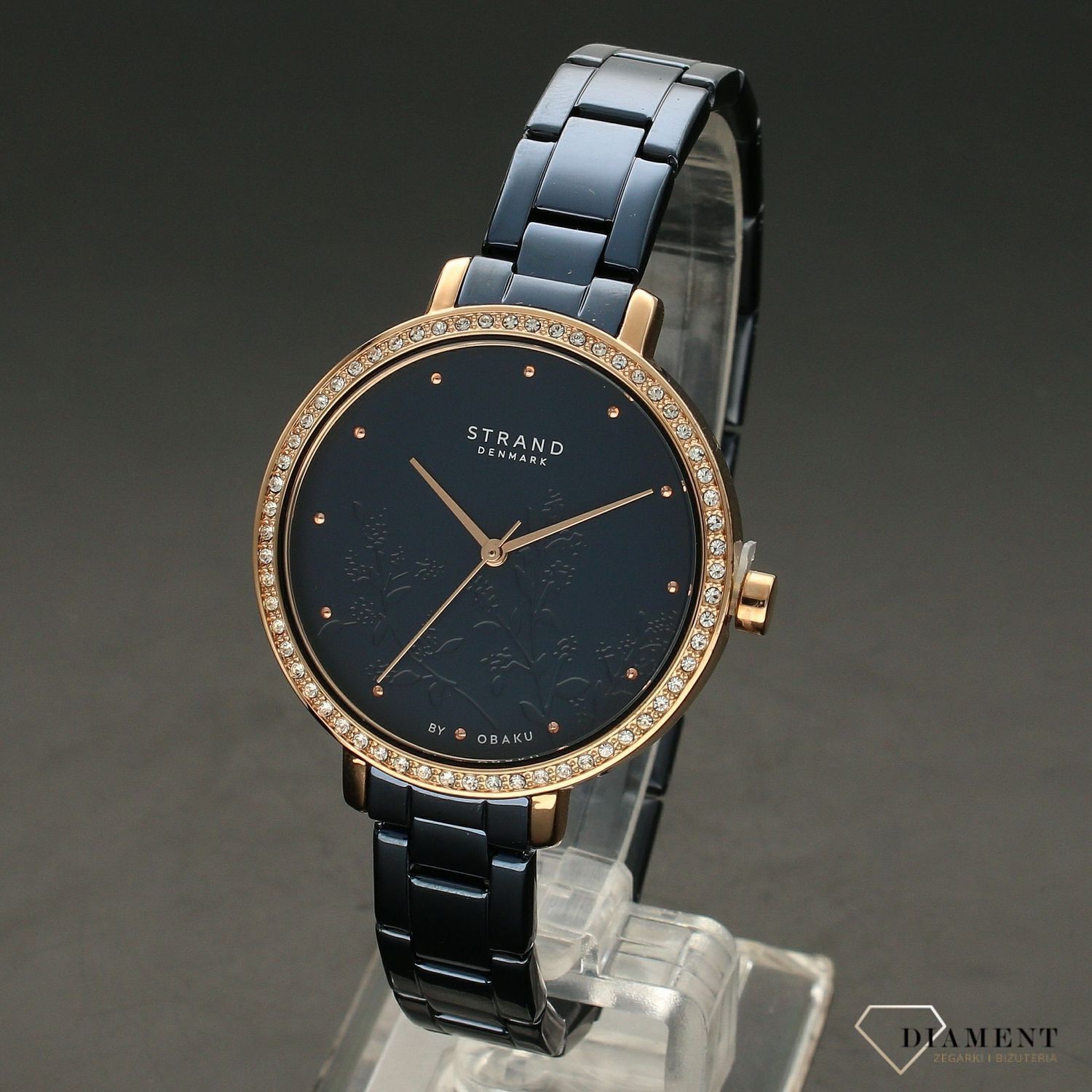 Zegarek damski STRAND Pacifica S712LXVLSL. Strand Pacifica to elegancki zegarek damski z oryginalną, granatową tarczą, ozdobioną motywem kwiatowym. Zegarek damski posiada indeksy z różowego złota. Tarcza ozdobiona j8.jpg