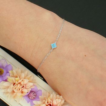 Delikatna srebrna bransoletka z niebieskim kwiatkiem – regulowana 17–20 cm blue.jpg