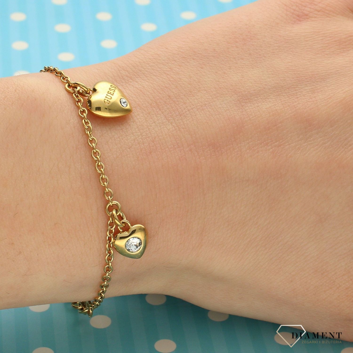 Bransoletka GUESS pozłacana trzy serca UBB70038-S.jpg