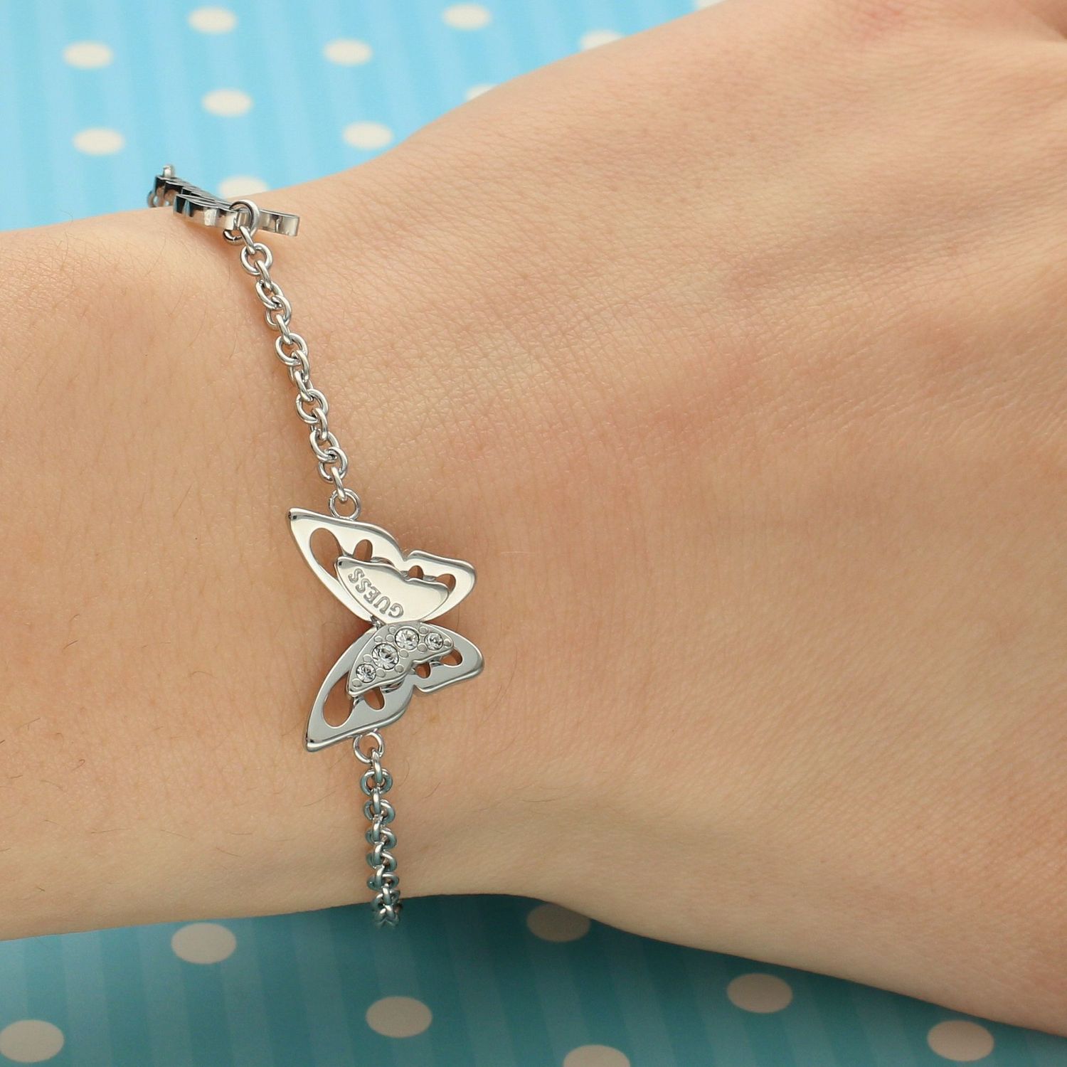 Bransoletka GUESS stalowa z motylkiem i kryształami UBB70115-S.jpg