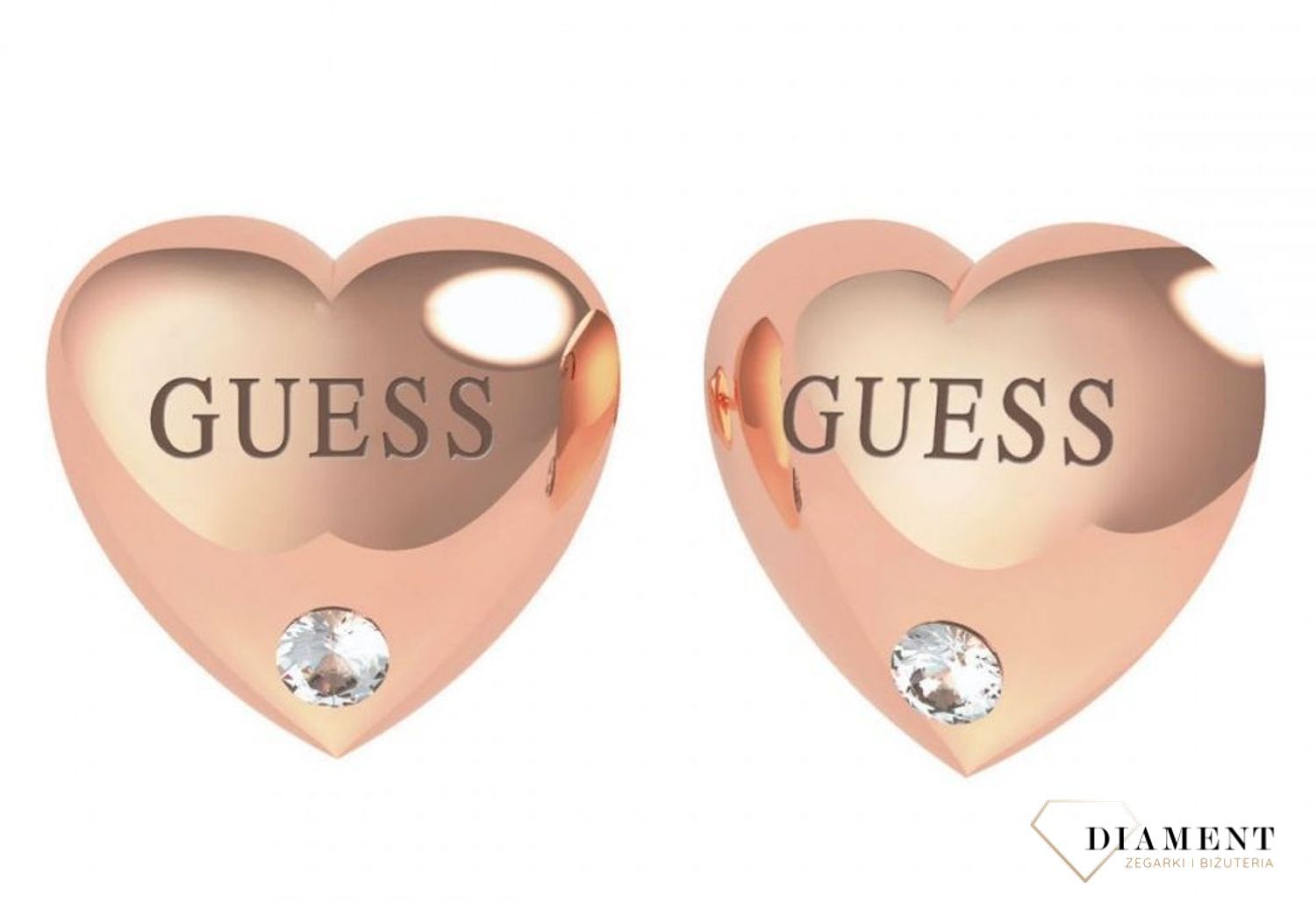 Kolczyki serca GUESS różowe złoto z cyrkonią UBE70106. Stalowe kolczyki w kształcie serca ozdobione napisem Guess i błyszczącą cyrkonią. Kolczyki w kolorze różowego złota, wypukłe..jpg