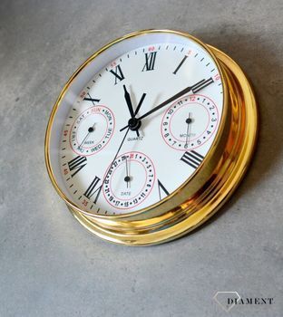 Zegar wyposażony jest w kwarcowy mechanizm, zasilany za pomocą baterii. MULTIDATA Zegar złoty mały z kalendarzem rozmieszczonym na trzech małych tarczach.  (8).JPG