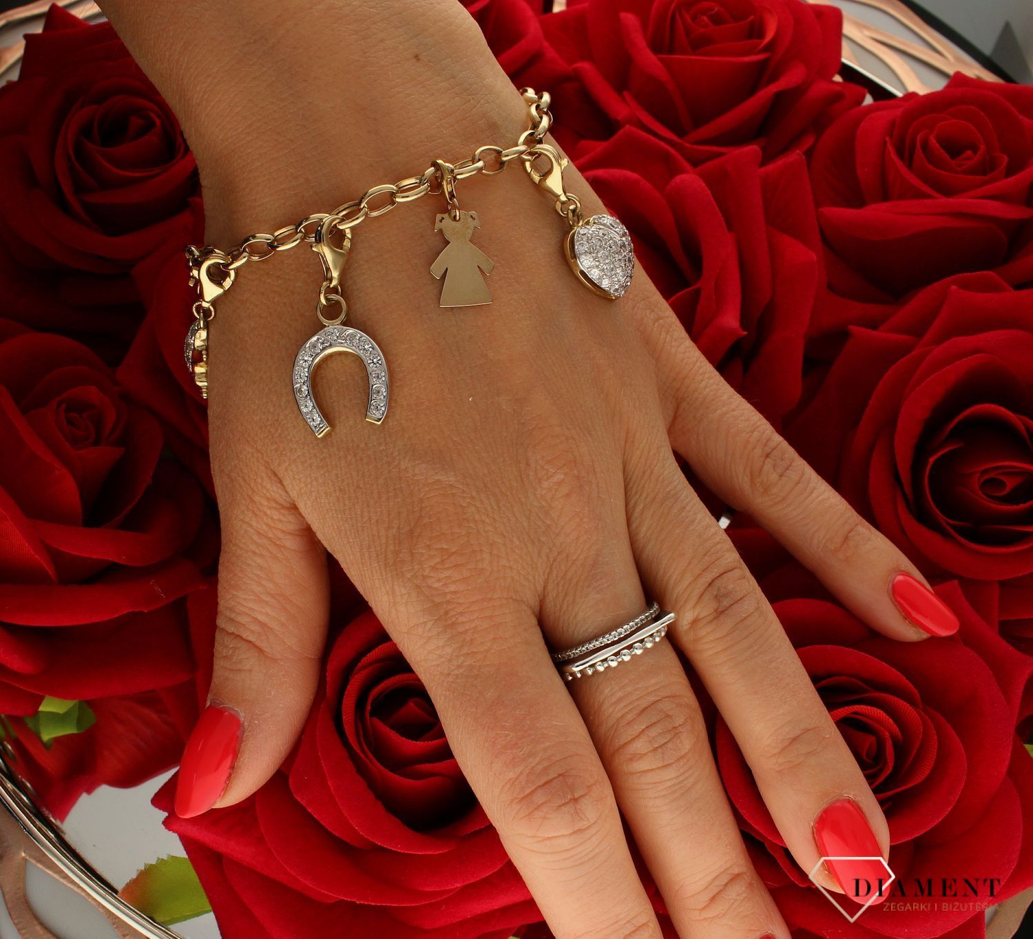 Złoty charms do bransoletki 585 wypukłe serduszko z cyrkoniami Z08-D00-ZLB5423. Zawieszkę w kształcie serduszka można doczepić do bransoletki za pomocą karabińczyka. Zawieszka to idealny pomysł na prezent dla każdej kobiety..jpg