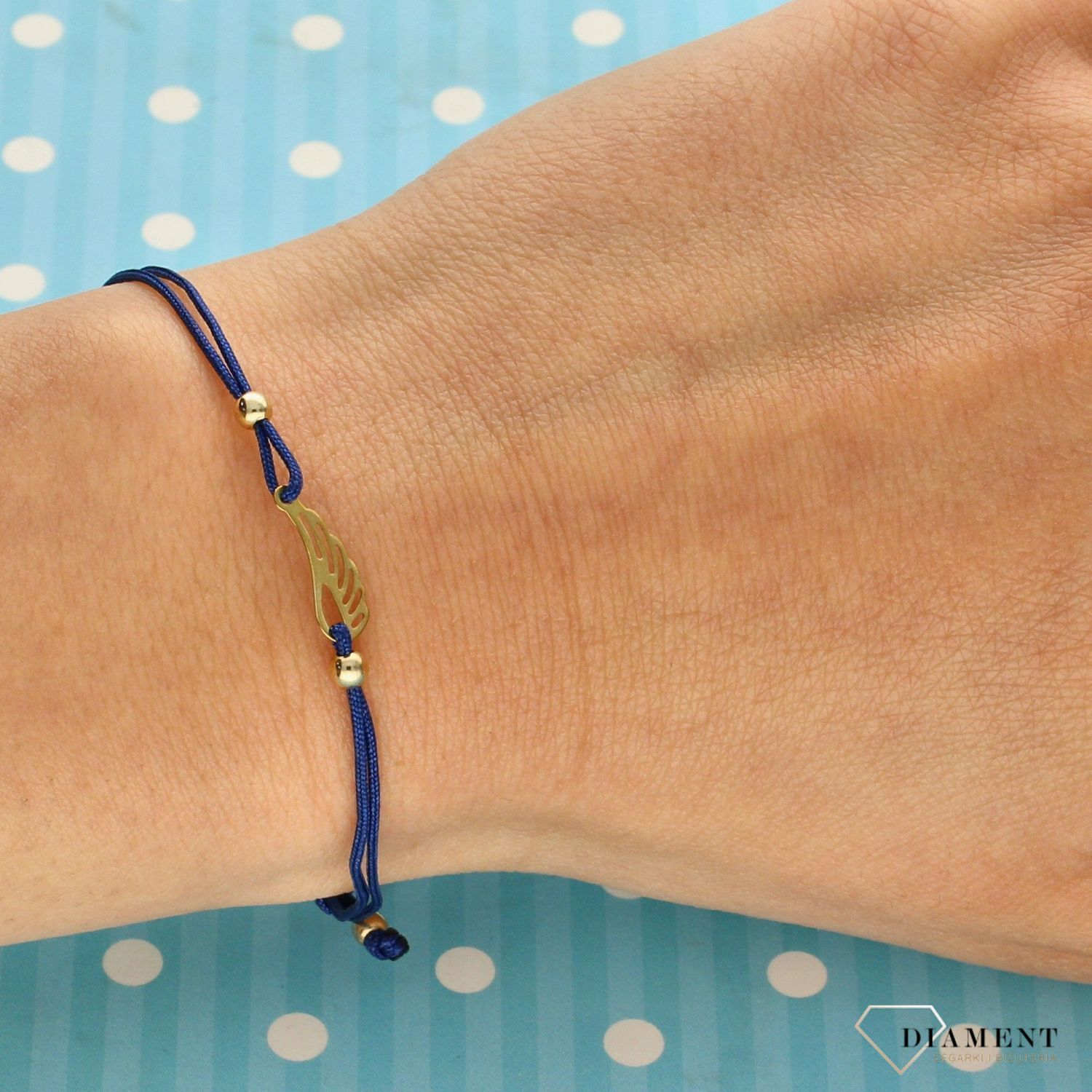 Bransoletka złota 333 niebieski sznurek piórko (1).jpg