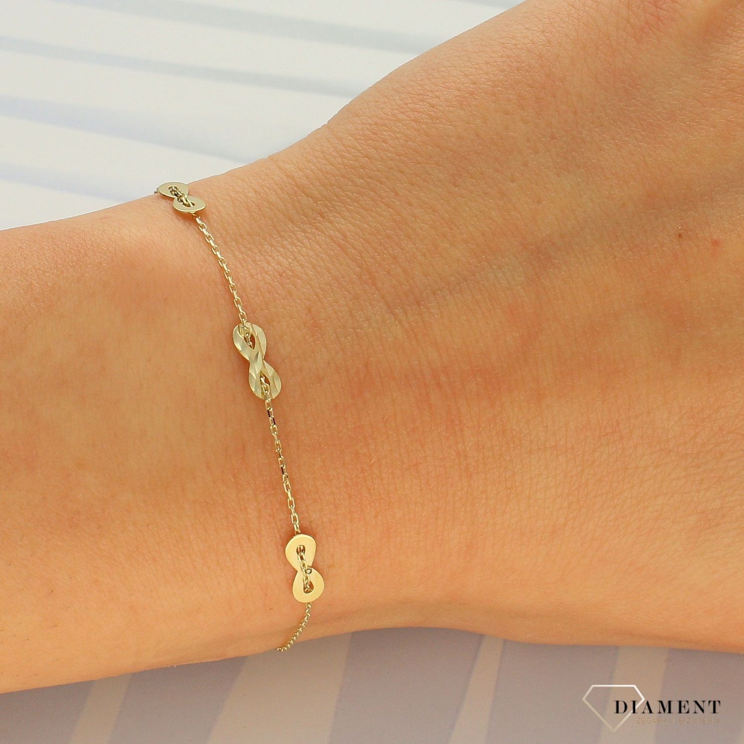 Złota bransoletka damska 333 ankier znak nieskończoności ZW-X-X09-N18-DA18348.jpg