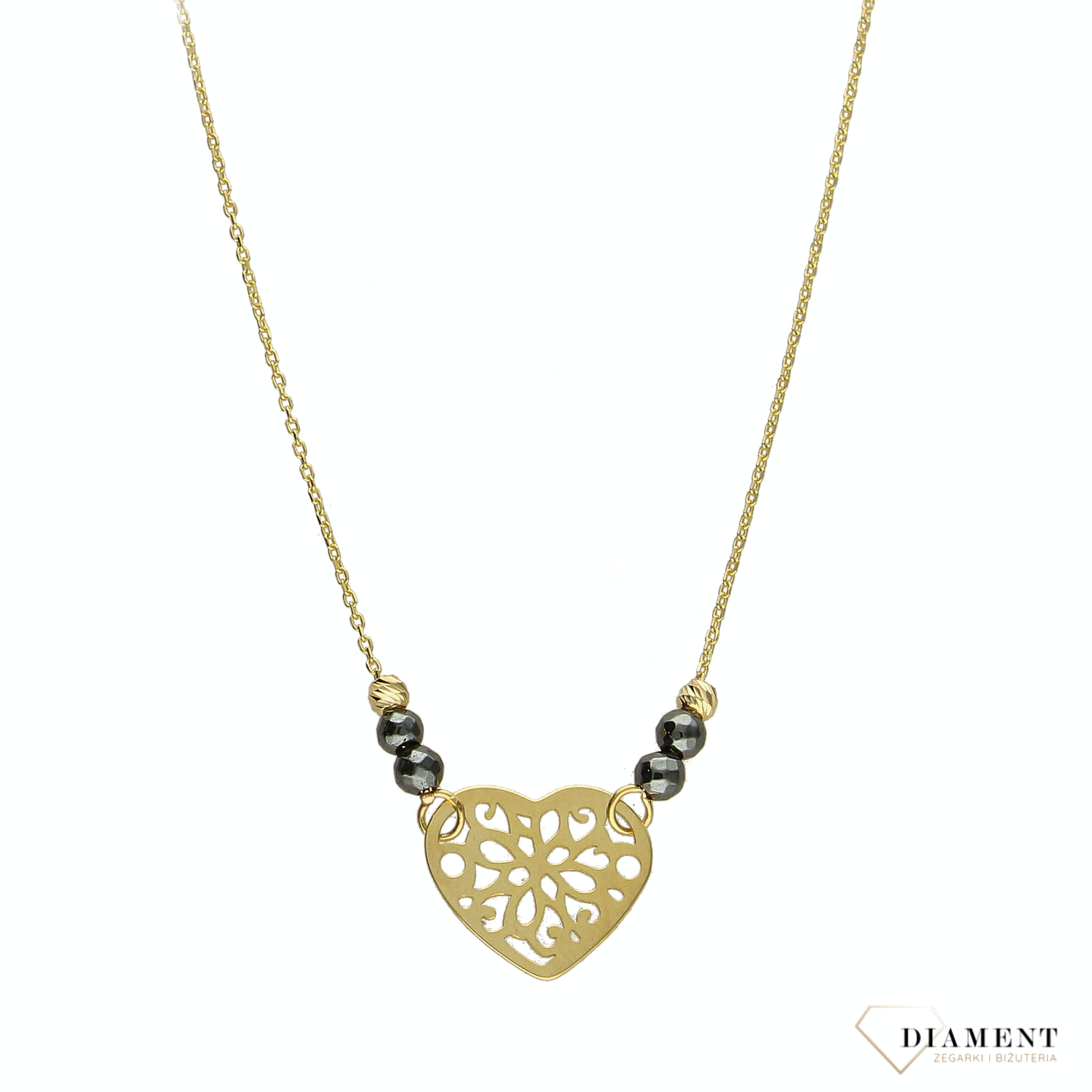 Złoty naszyjnik celebrytka próby 333 serce ZW-X-X09-N42-CW17835 .Złoty naszyjnik celebrytka z elementem ozdobnym w postaci serca ozdobione po obu stronach kuleczkami czarnymi oraz złotymi. .png