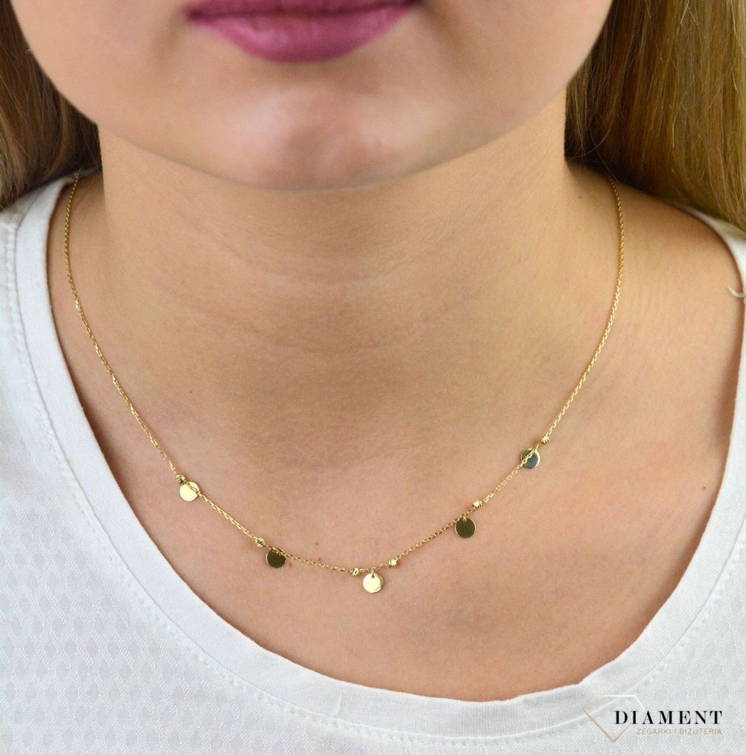 Złoty naszyjnik celebrytka próby 333 kółka z kuleczkami ZW-X-X09-N45-CA17928. Złoty naszyjnik celebrytka z elementem ozdobnym w postaci kółek z kuleczkami. Wykonana ze 8-karatowego żółtego złota, próba 333.png