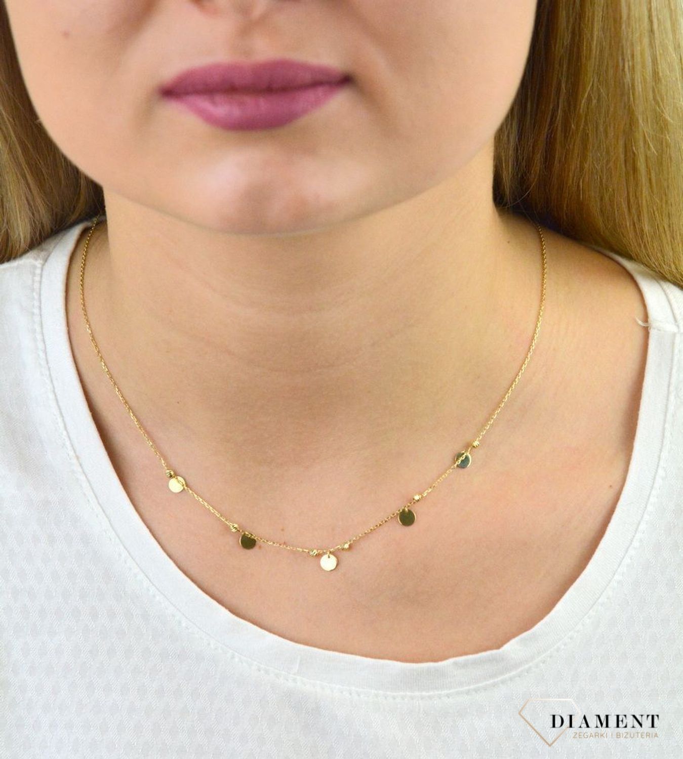 Złoty naszyjnik celebrytka próby 333 kółka z kuleczkami ZW-X-X09-N45-CA17928. Złoty naszyjnik celebrytka z elementem ozdobnym w postaci kółek z kuleczkami. Wykonana ze 8-karatowego żółtego złota, próba 333.png