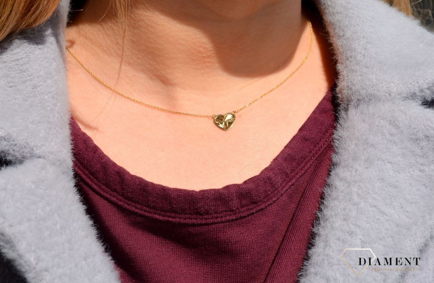 Złoty naszyjnik z serduszkiem w którym widnieje ekg puls linia życia. Biżuteria została wykonana z najwyższej jakości lśniącego złota próby 333.jpg