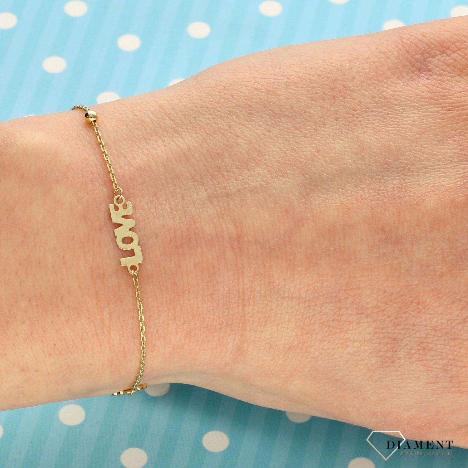 Piękna złota bransoletka celebrytka z miłosnym motywem to świetny pomysł na prezent dla ukochanej kobiety. Złota bransoletka wykonana z próby 585.  (1).jpg